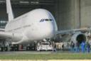 Airbus A380 emerging from an assembly hangar