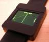 Home-built OLED microcontroller watch that plays Pong by itself