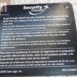 Showing the tag on the case stating that it's airport security compliant
